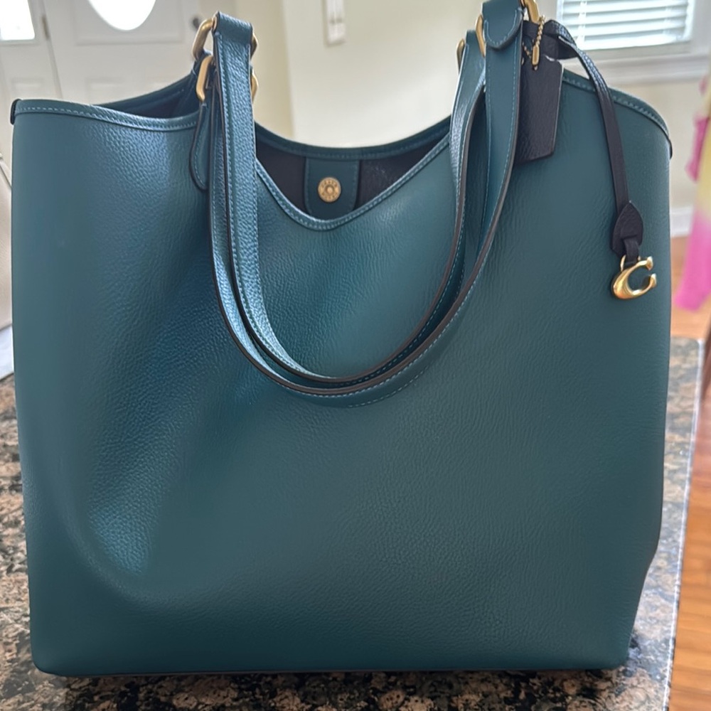 Elegant Coach teal tote used a few times excellent condition